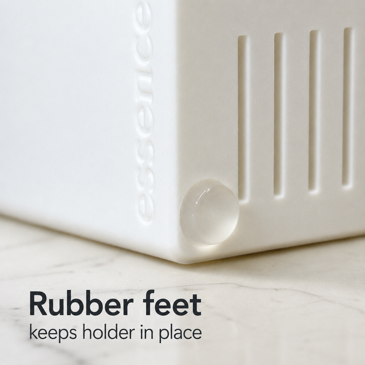 White holder with rubber feet on a marble surface, featuring the rubber feet keeps the holder in place