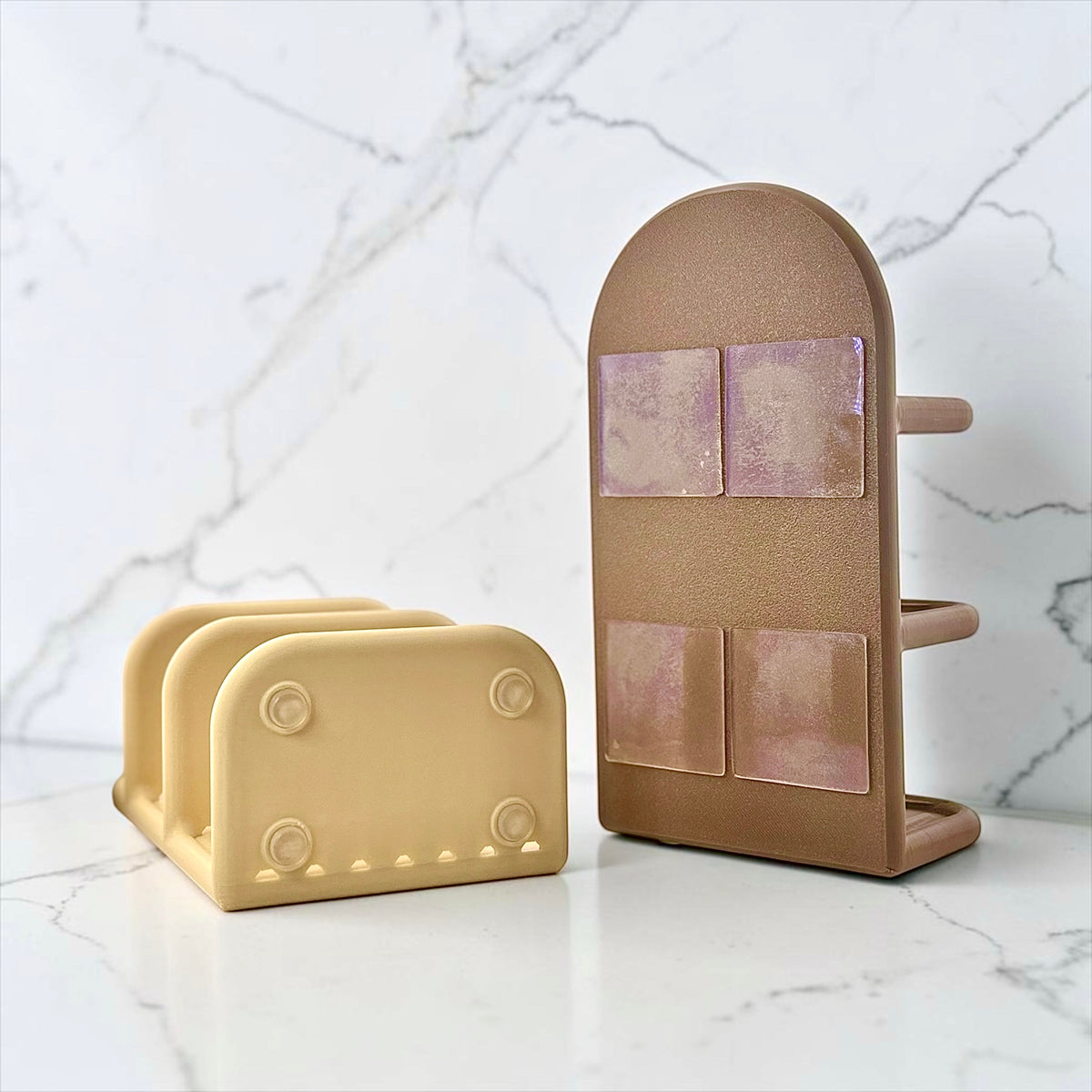 Two bath caddies. One beige soap holder showing the rubber feet and another soap holder showing the mounting tape in the back