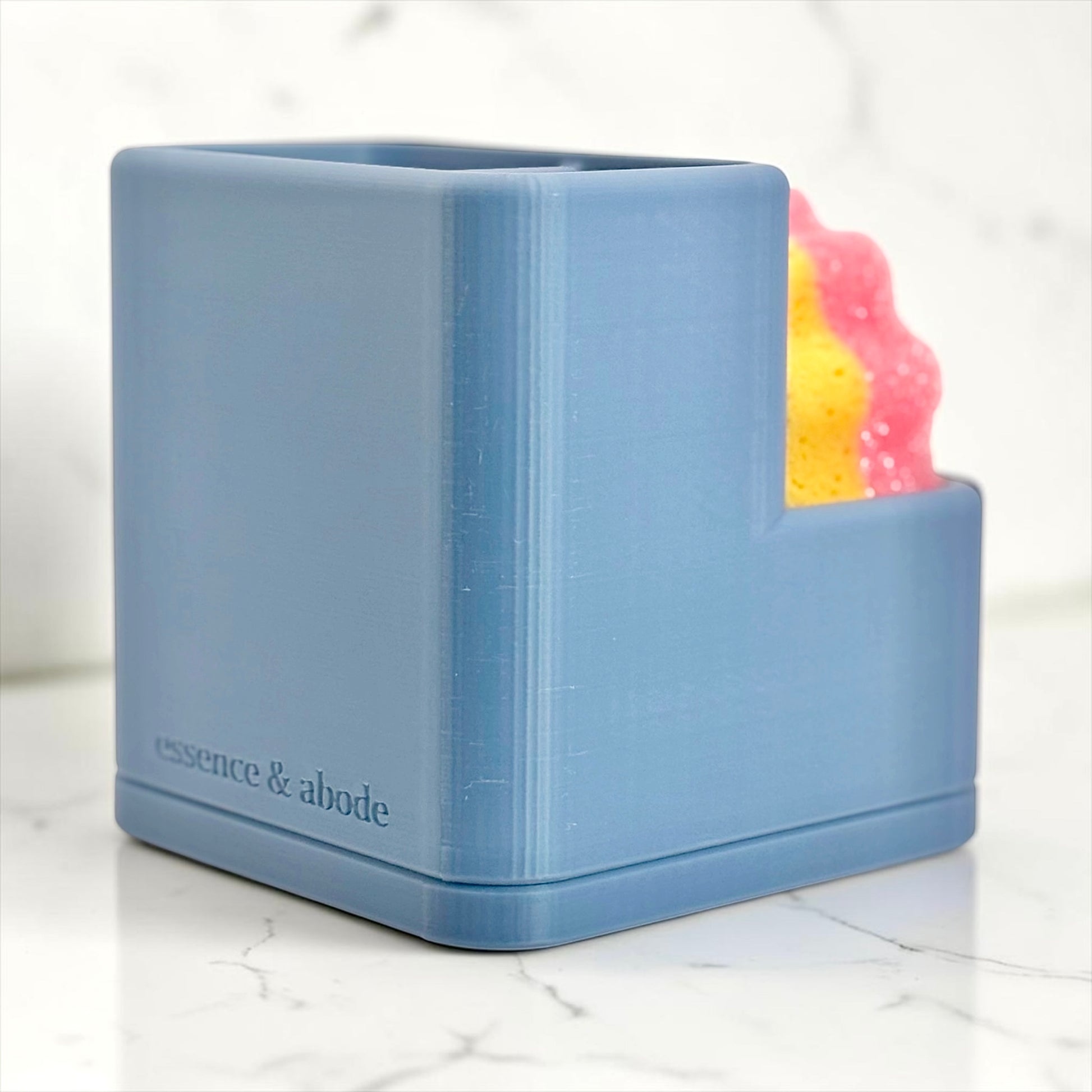 Blue sink caddy viewed from the back on a white background