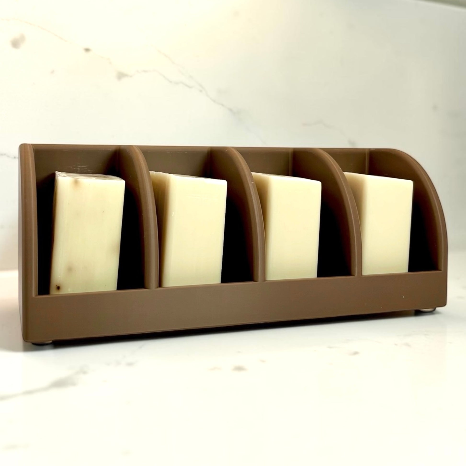 cocoa Brown soap holder with four bars of soap in each slot on a light background