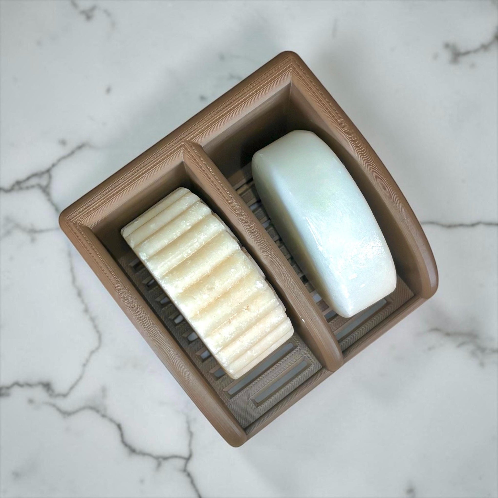 Cocoa Brown soap dish with two bars of soap on a marble surface