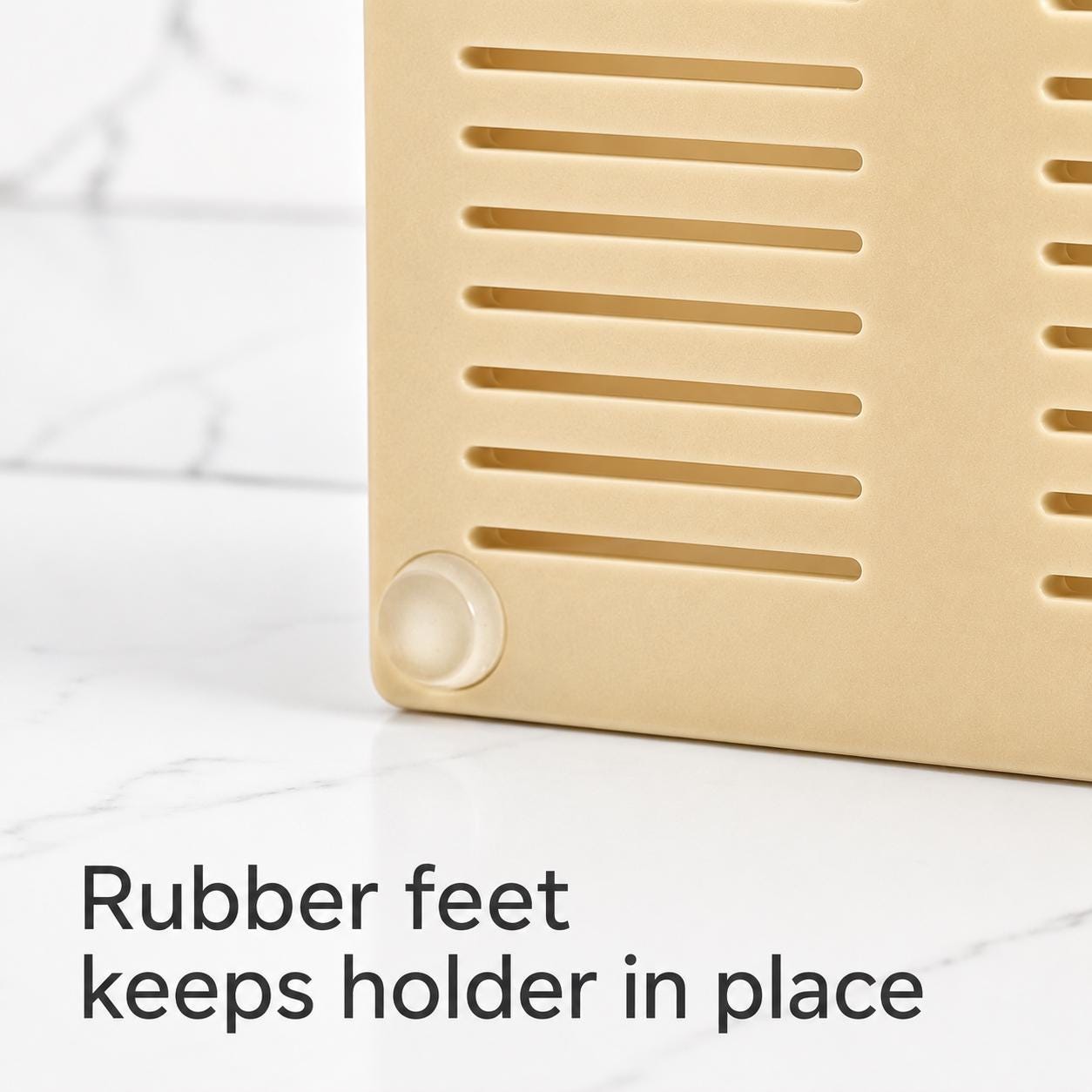 Beige holder with rubber feet on a white surface